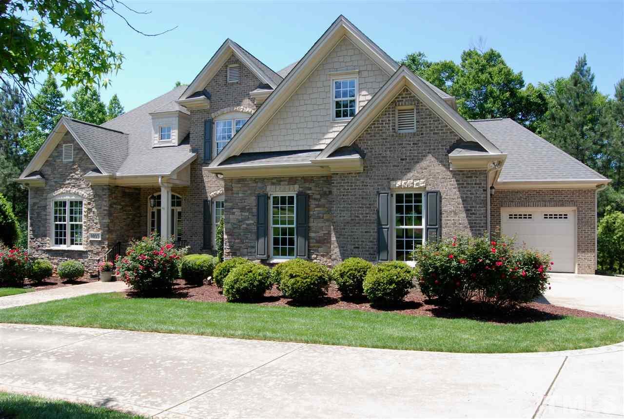 1093 Tacketts Pond Drive Raleigh, NC 27614 - Photo 22 of 25 a front view of a house with a garden and plants