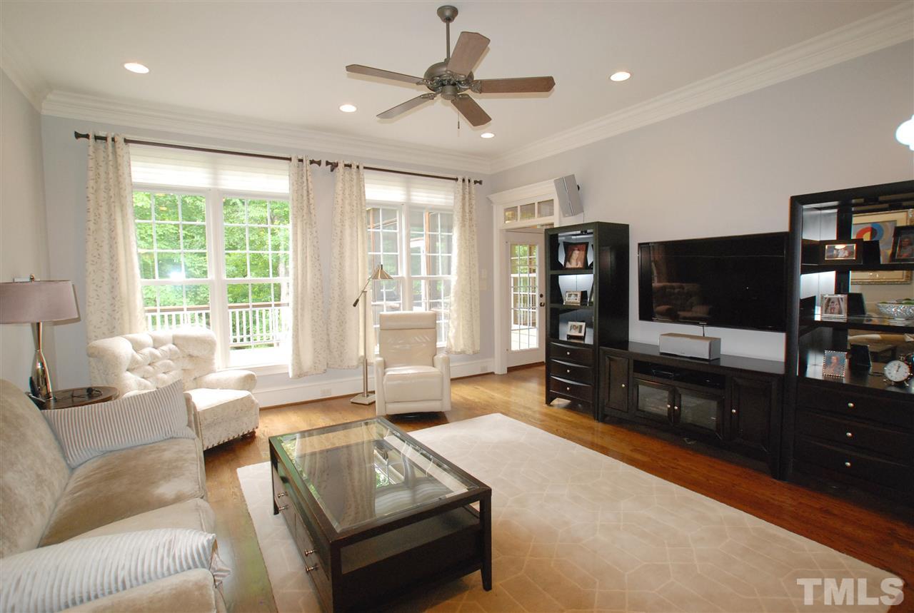 1093 Tacketts Pond Drive Raleigh, NC 27614 - Photo 6 of 25 a living room with furniture and a flat screen tv