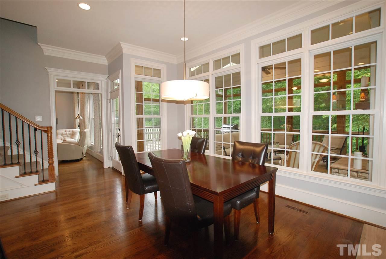 1093 Tacketts Pond Drive Raleigh, NC 27614 - Photo 7 of 25 a view of a dining room with furniture window and wooden floor
