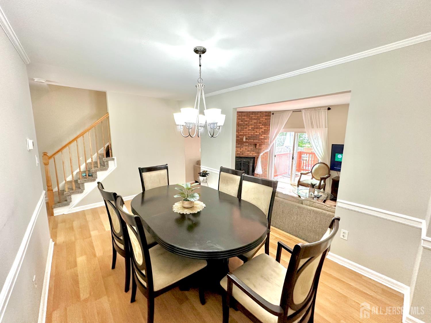 41 Brookview Circle Jamesburg, NJ 08831 - Photo 11 of 38 a view of a dining room with furniture and chandelier