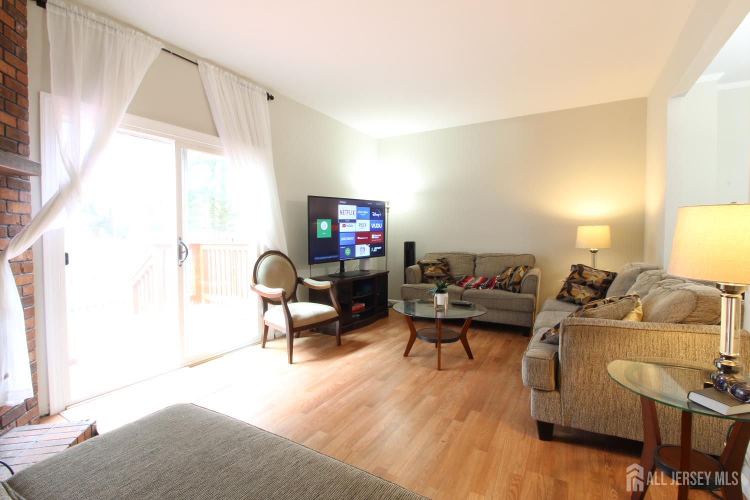 41 Brookview Circle Jamesburg, NJ 08831 - Photo 15 of 38 a living room with furniture or couch and a window
