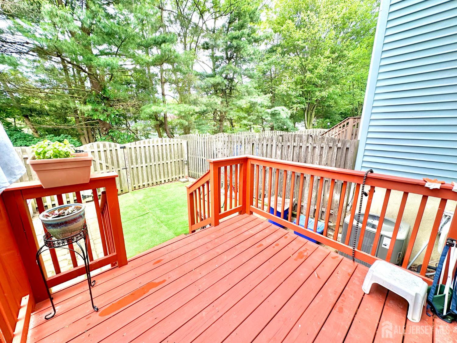 41 Brookview Circle Jamesburg, NJ 08831 - Photo 17 of 38 a balcony with wooden floor and trees
