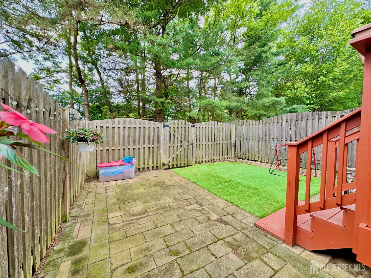 41 Brookview Circle Jamesburg, NJ 08831 - Photo 19 of 38 a view of a backyard with a trees and wooden fence