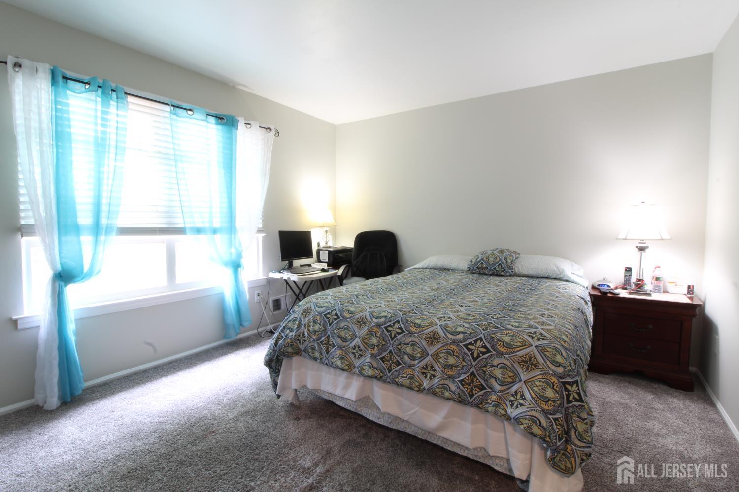 41 Brookview Circle Jamesburg, NJ 08831 - Photo 30 of 38 a bedroom with a bed and window