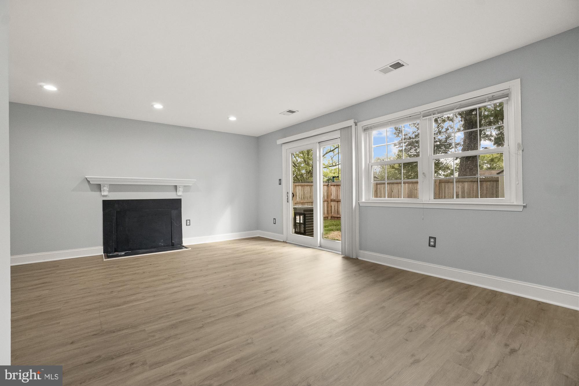 17433 Hoskinson Road Poolesville, MD 20837 - Photo 13 of 50 Big living room with fireplace and new double door