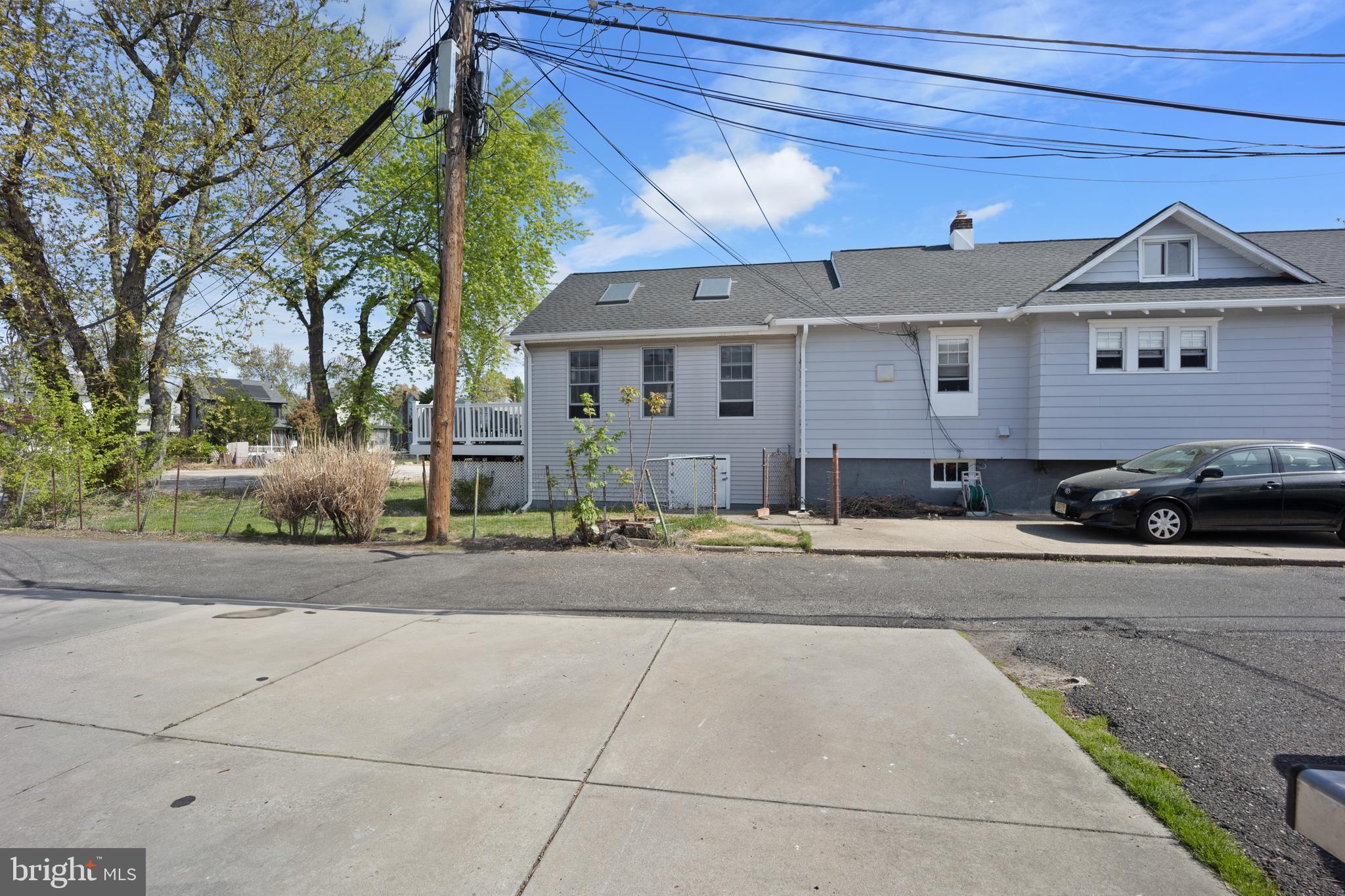 117 Haddon Avenue Haddon Township, NJ 08108 - Photo 14 of 30 a front view of a house with a yard and garage