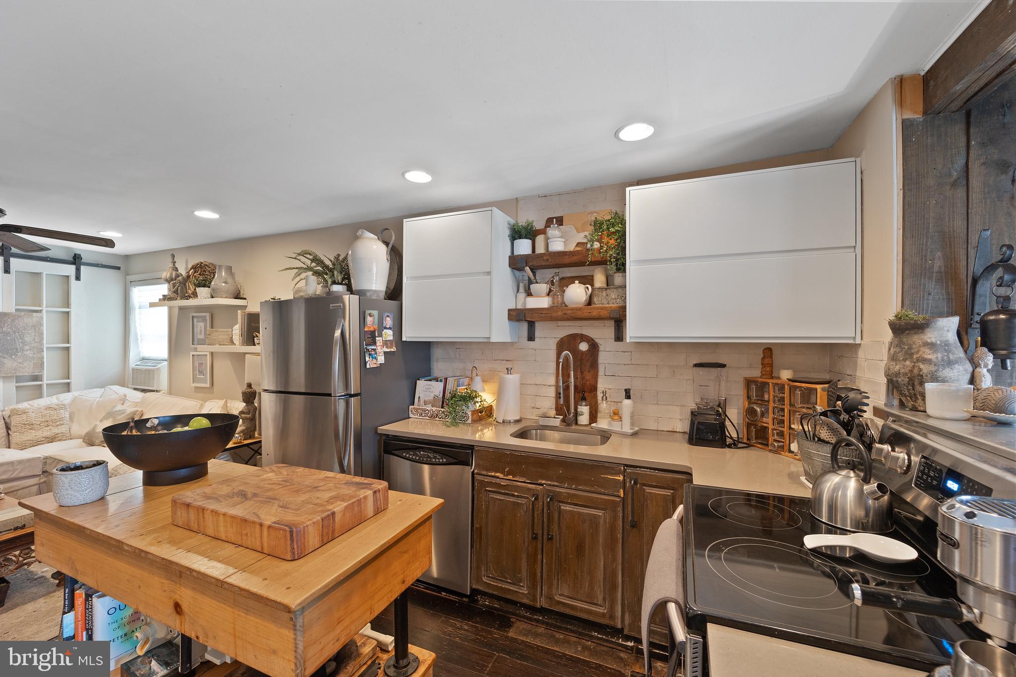117 Haddon Avenue Haddon Township, NJ 08108 - Photo 17 of 30 a kitchen with a sink cabinets and refrigerator