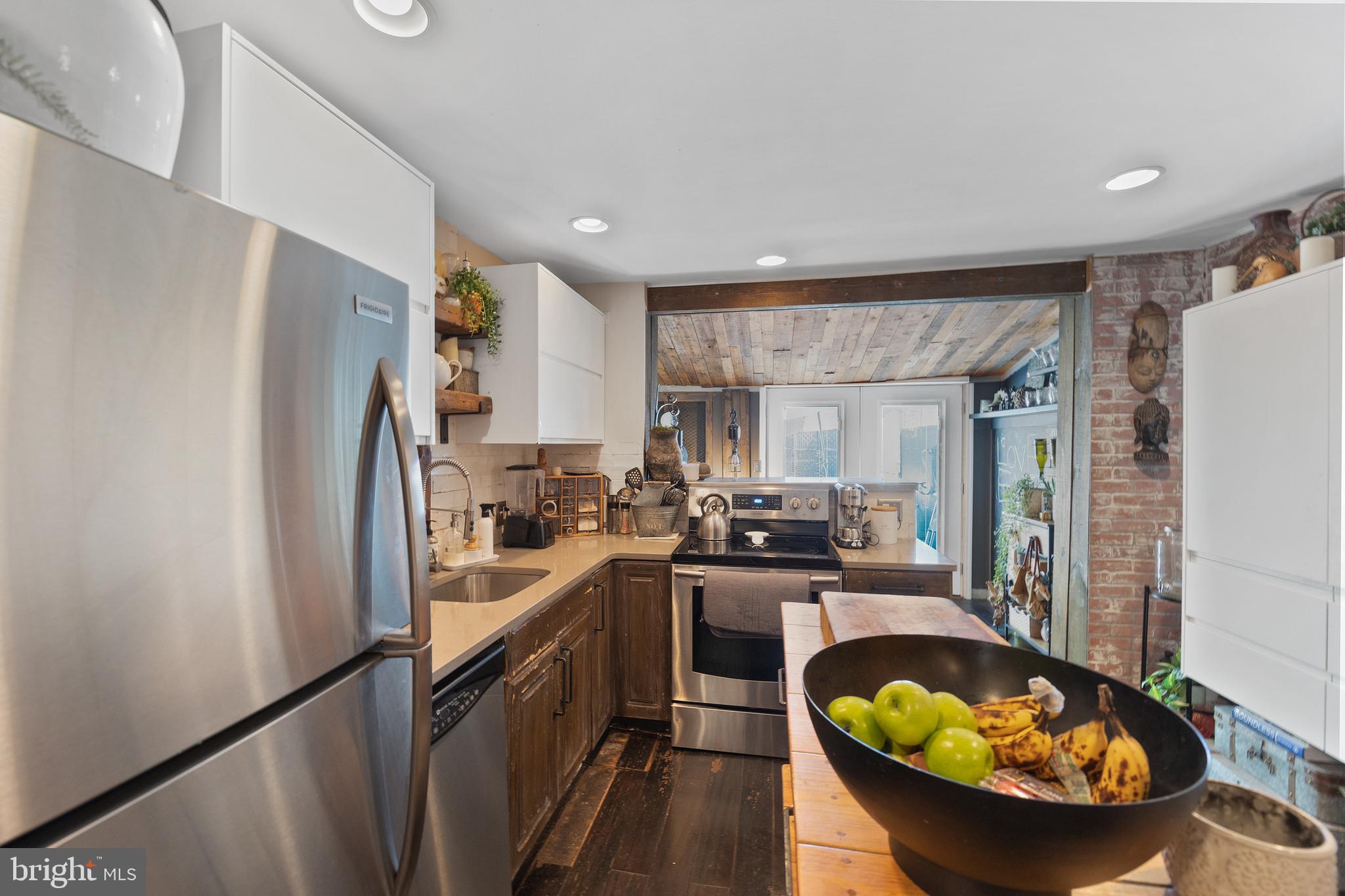 117 Haddon Avenue Haddon Township, NJ 08108 - Photo 18 of 30 a kitchen with stainless steel appliances granite countertop a sink stove and refrigerator
