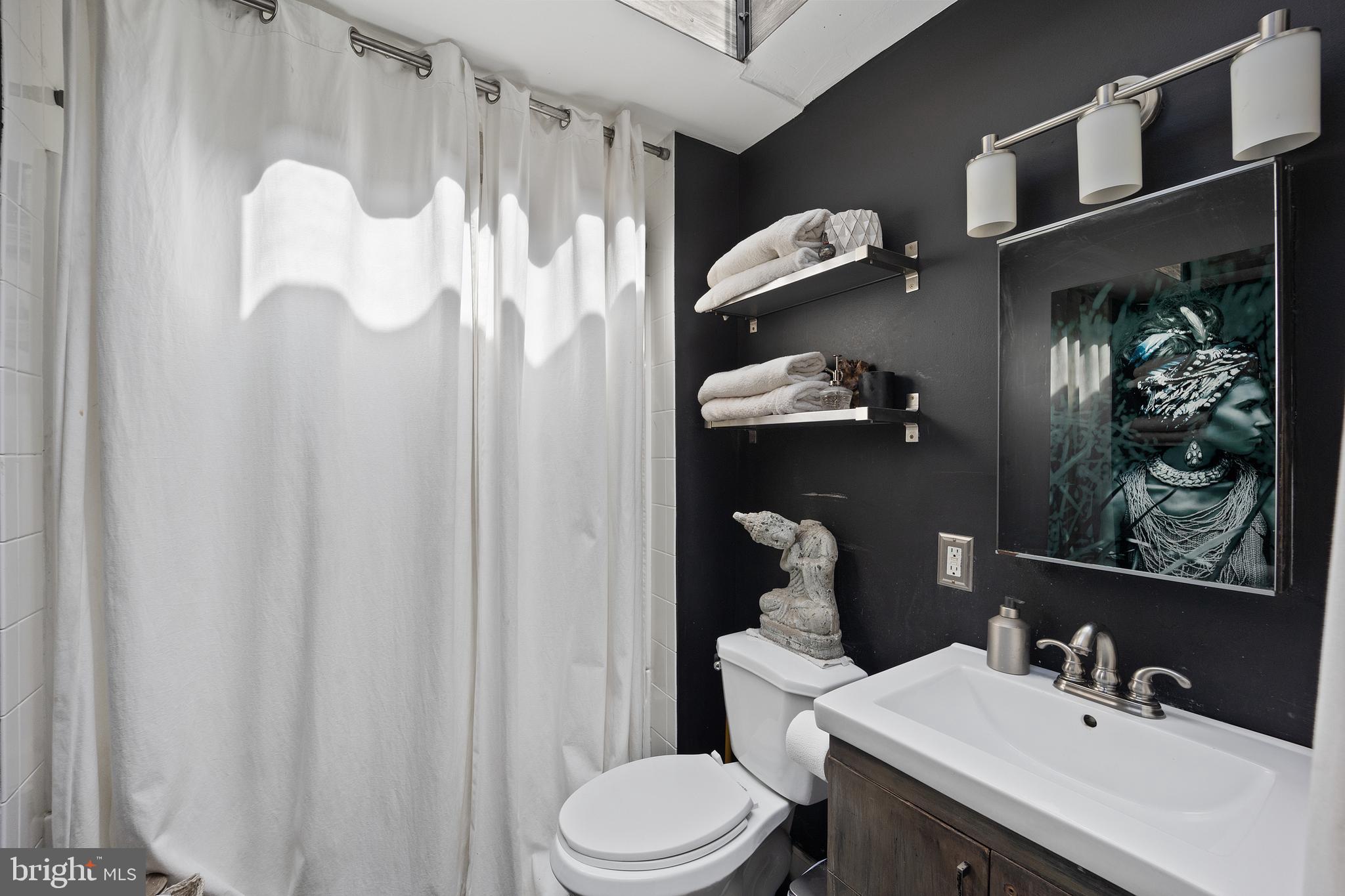 117 Haddon Avenue Haddon Township, NJ 08108 - Photo 25 of 30 a bathroom with a sink vanity mirror and toilet