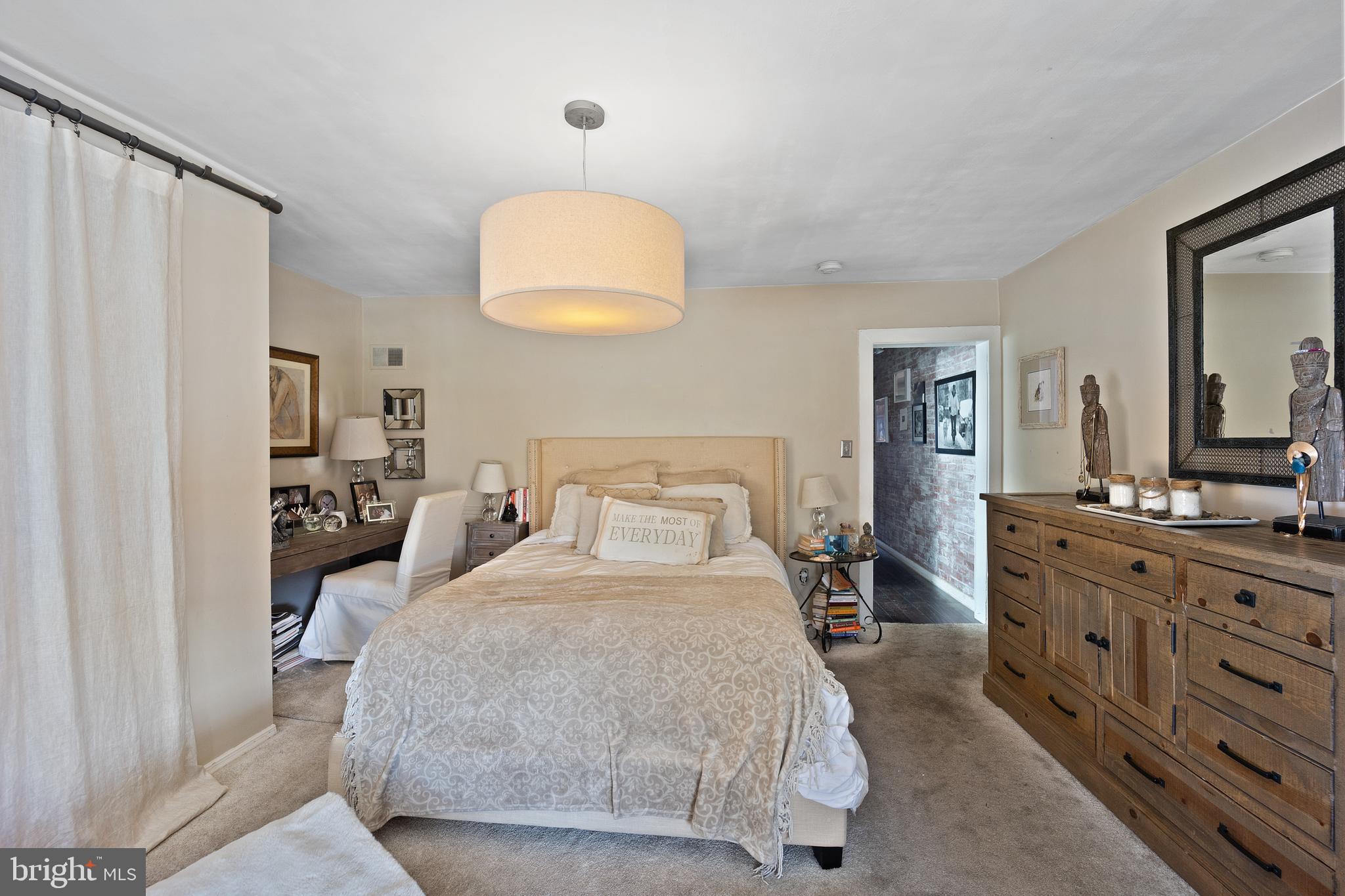 117 Haddon Avenue Haddon Township, NJ 08108 - Photo 27 of 30 a bedroom with a large bed and a chandelier