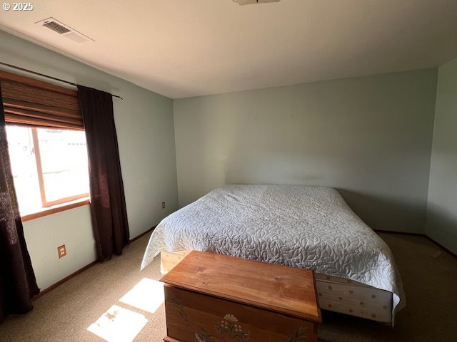 1627 Maple Street Myrtle Point, OR 97458 - Photo 16 of 23 a bedroom with a bed and a window