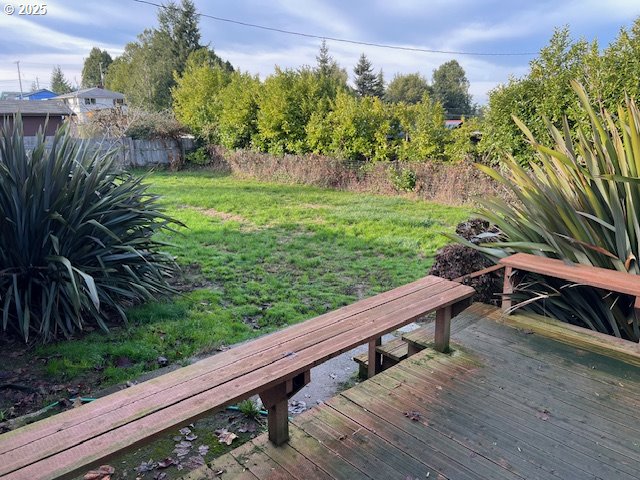 1627 Maple Street Myrtle Point, OR 97458 - Photo 7 of 23 a view of a wooden bench and trees in a backyard