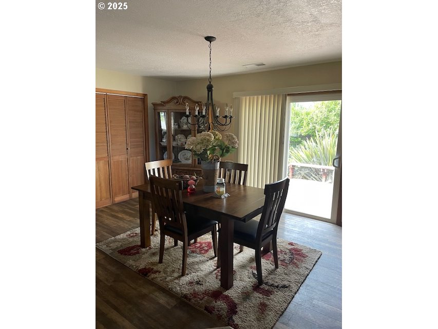1627 Maple Street Myrtle Point, OR 97458 - Photo 9 of 23 a view of a dining room with furniture window and outside view