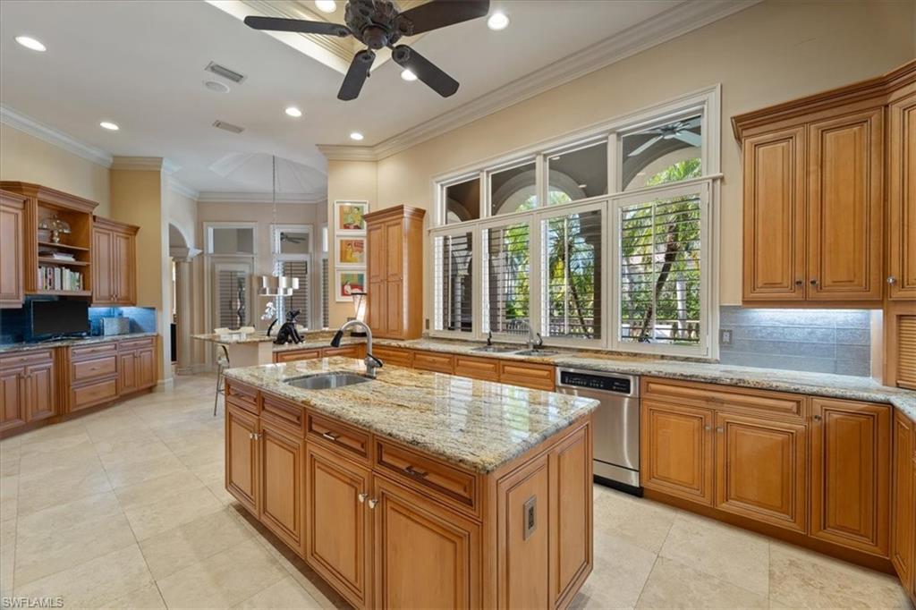 550 21st Avenue South Naples, FL 34102 - Photo 11 of 44 Kitchen with stainless steel dishwasher, open shelves, a sink, a kitchen island with sink, and visible vents