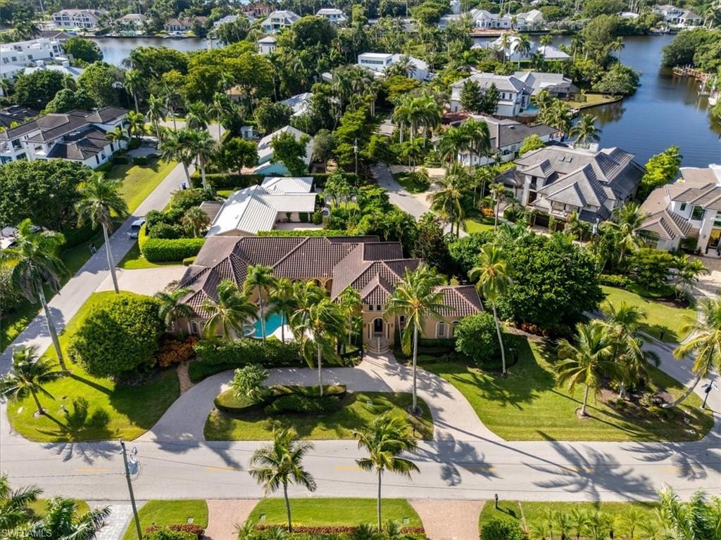 550 21st Avenue South Naples, FL 34102 - Photo 42 of 44 Aerial view of residential area featuring a nearby body of water