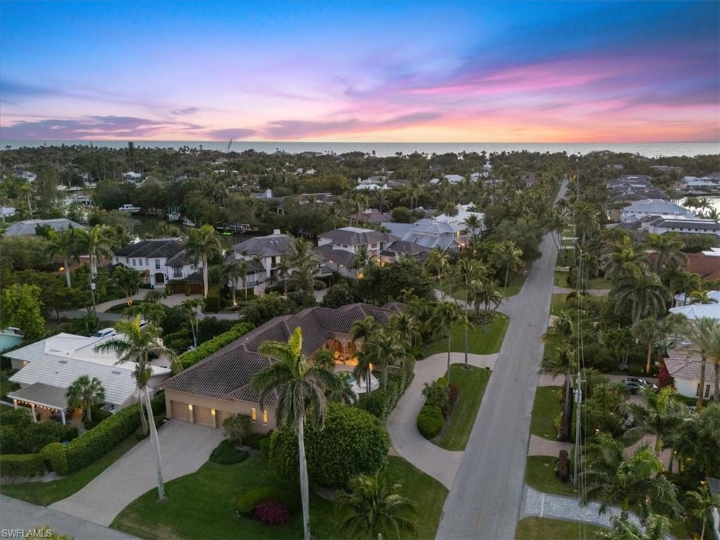 550 21st Avenue South Naples, FL 34102 - Photo 43 of 44 Aerial view at dusk with a residential view and a water view