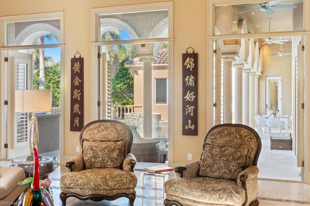 550 21st Avenue South Naples, FL 34102 - Photo 7 of 44 Living area featuring ceiling fan