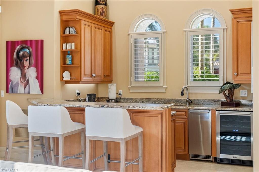 550 21st Avenue South Naples, FL 34102 - Photo 8 of 44 Bar featuring a sink and beverage cooler