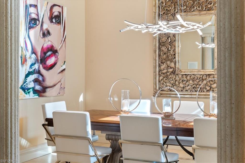 550 21st Avenue South Naples, FL 34102 - Photo 10 of 44 Dining room featuring a notable chandelier