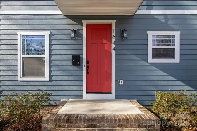 a view of a house with a door and a window