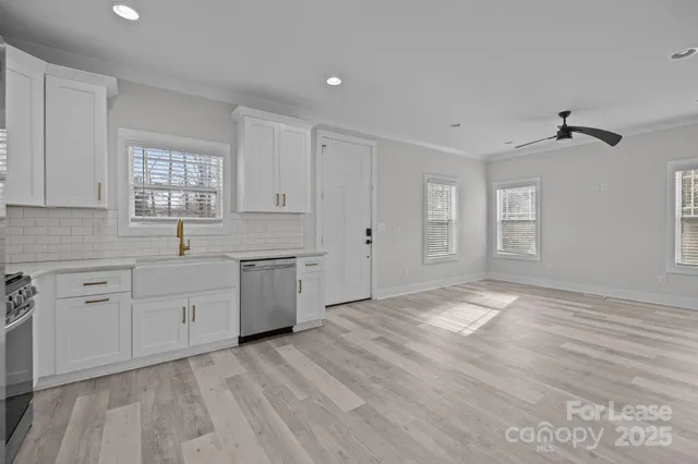 a view of a kitchen with electric appliances