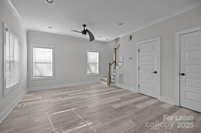 a view of an empty room with a window