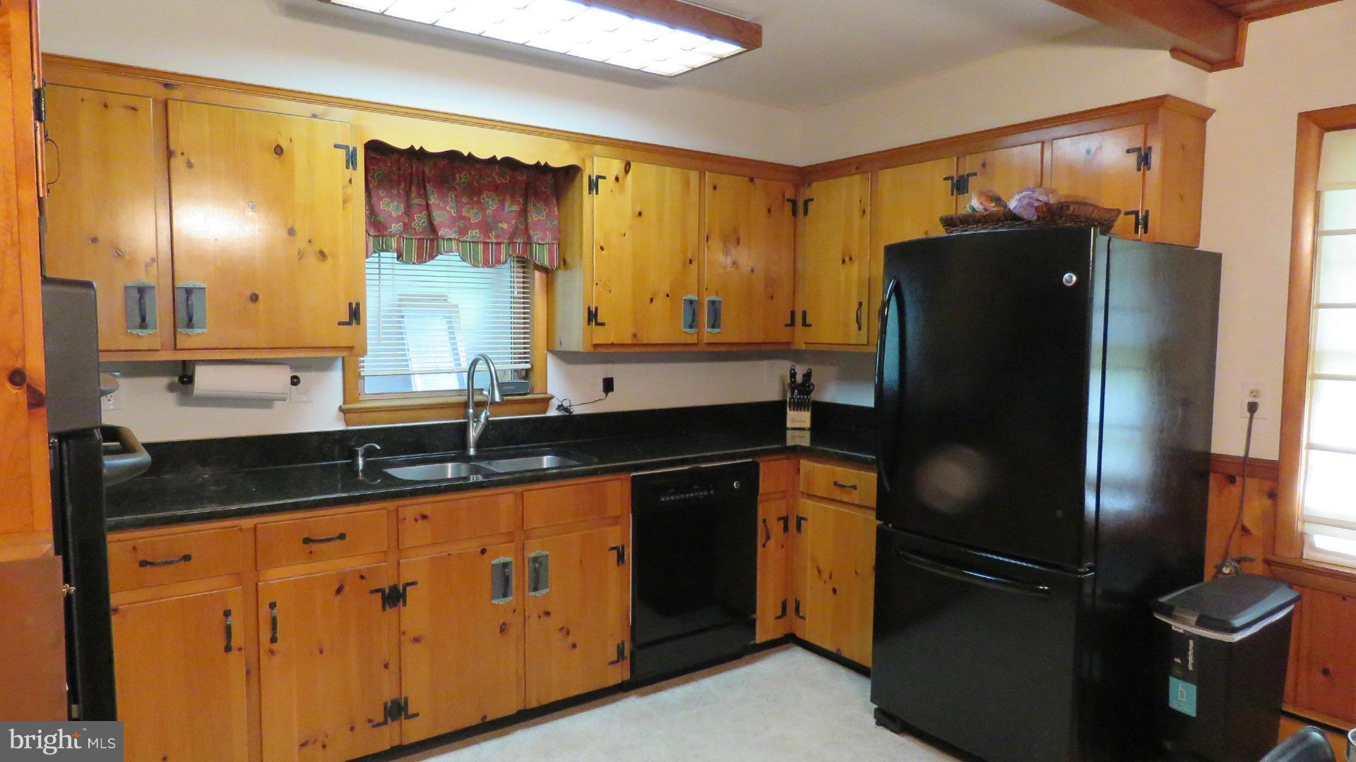 9813 Hawkins Creamery Road Damascus, MD 20872 - Photo 11 of 21 a kitchen with stainless steel appliances granite countertop a refrigerator and a sink