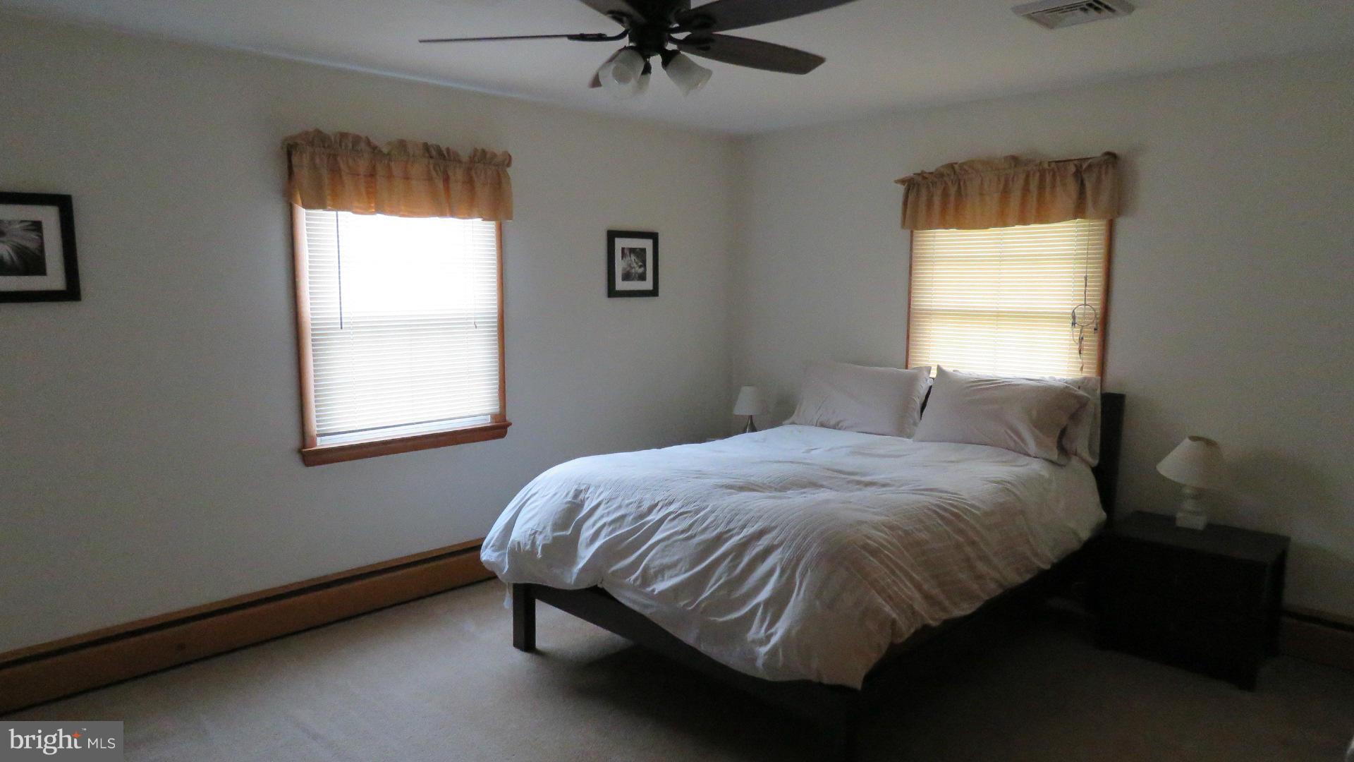 9813 Hawkins Creamery Road Damascus, MD 20872 - Photo 13 of 21 a bedroom with a bed and window