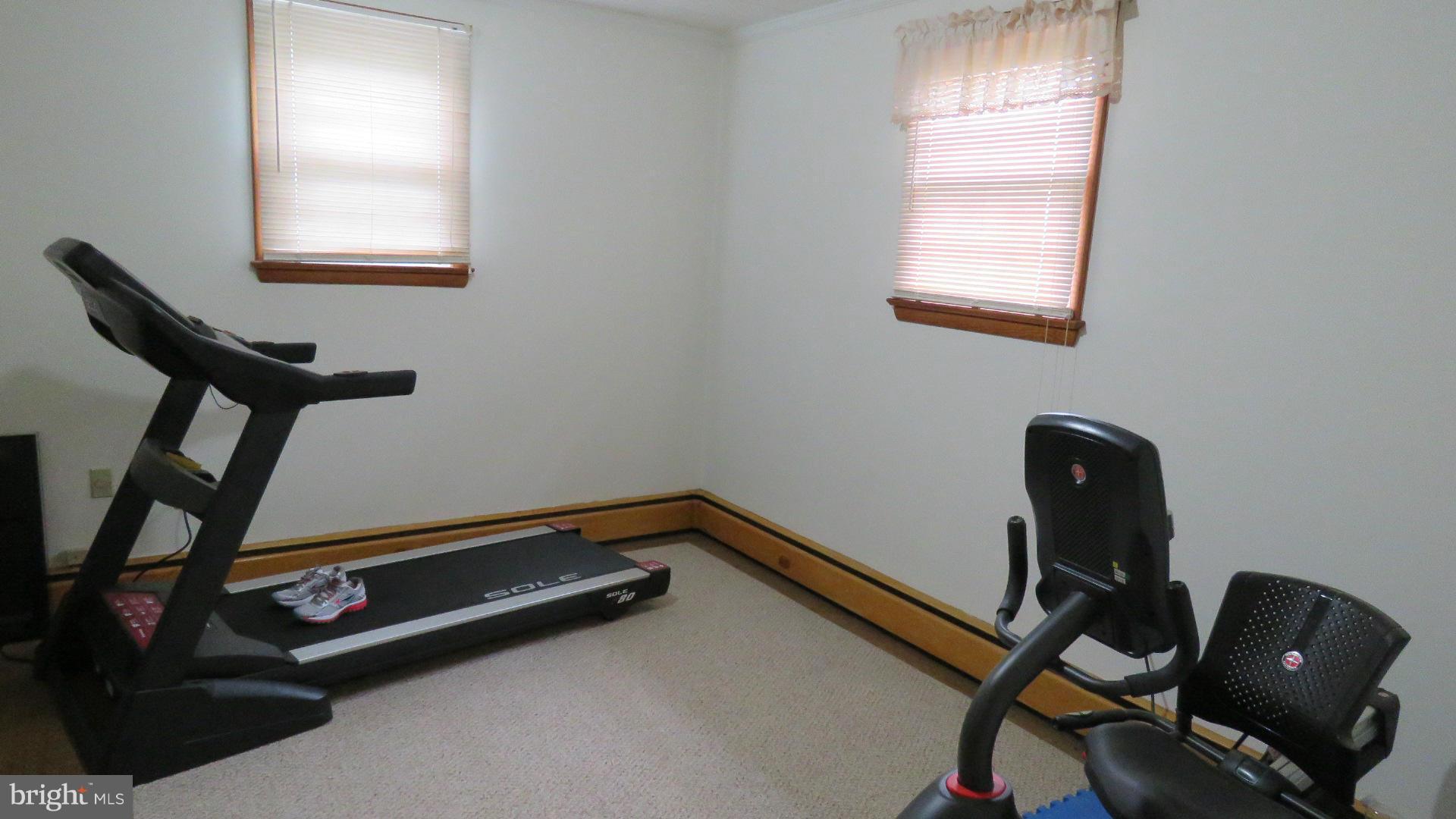 9813 Hawkins Creamery Road Damascus, MD 20872 - Photo 20 of 21 a room with gym equipment