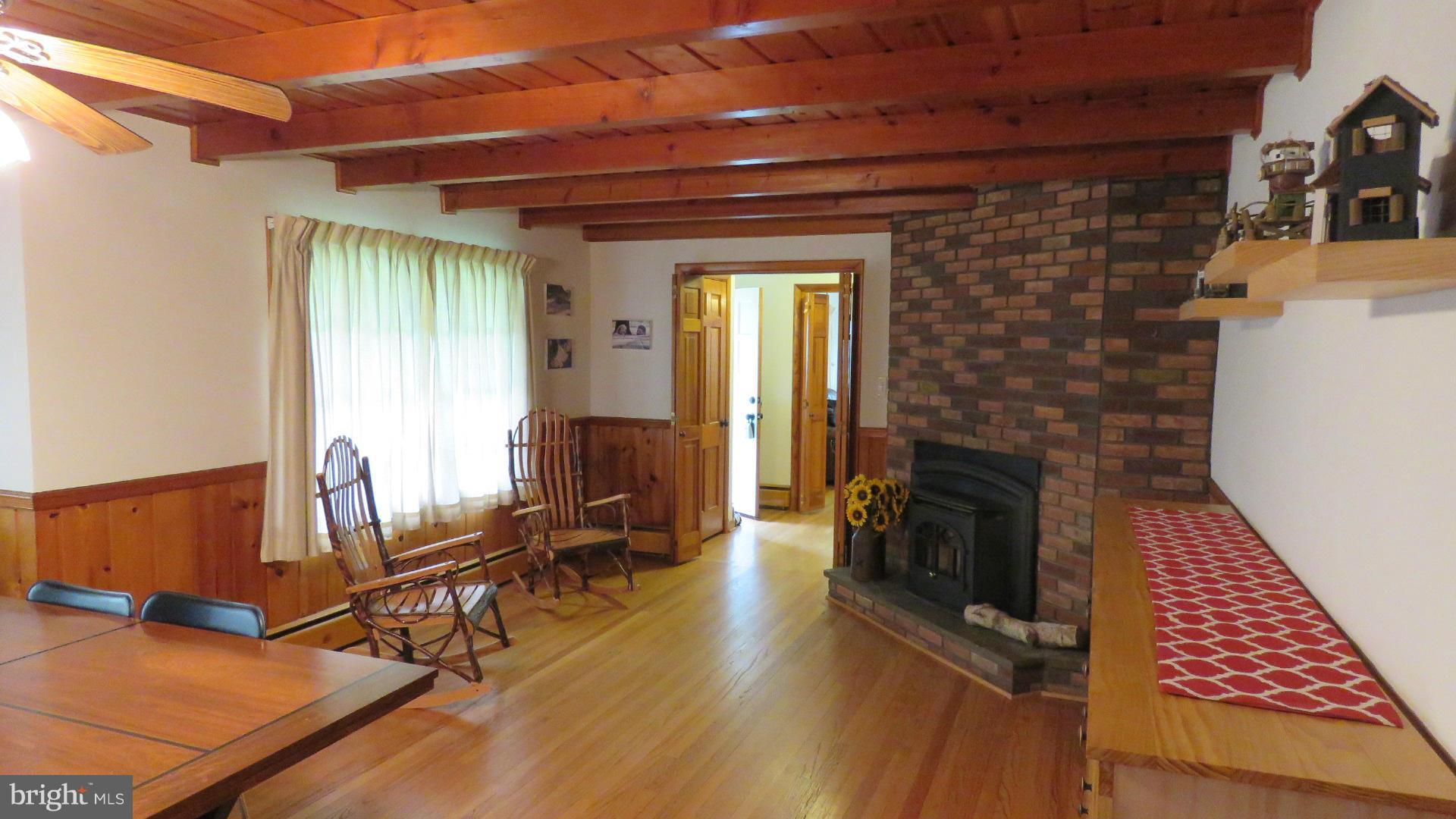 9813 Hawkins Creamery Road Damascus, MD 20872 - Photo 9 of 21 a view of a livingroom with furniture and a fireplace