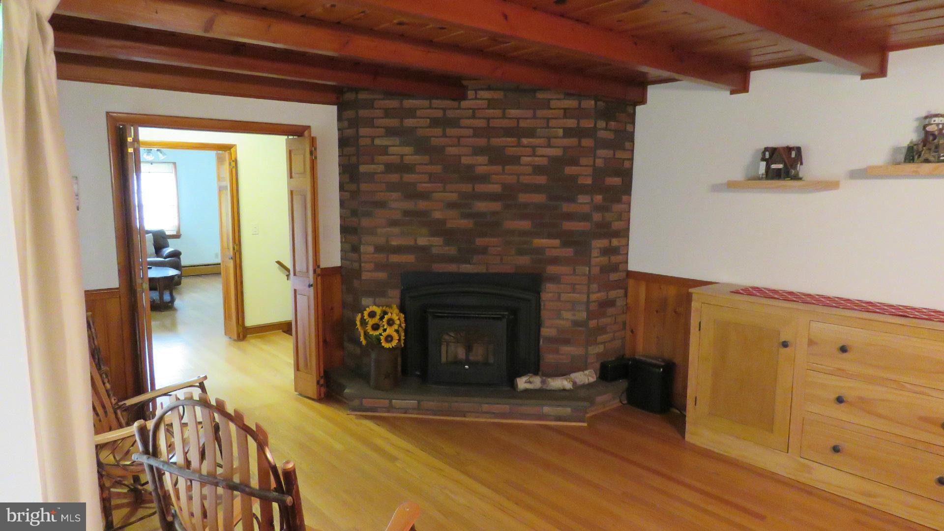 9813 Hawkins Creamery Road Damascus, MD 20872 - Photo 10 of 21 a view of a livingroom with furniture and a fireplace