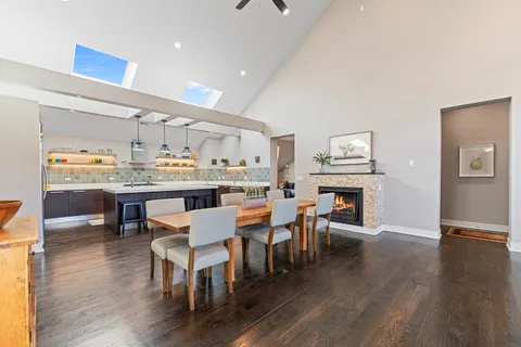 a living room with fireplace furniture and a wooden floor