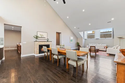 a living room with fireplace furniture and a wooden floor