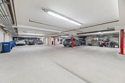 a view of parking garage with cars
