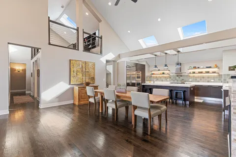 a view of a dining area with furniture and wooden floor