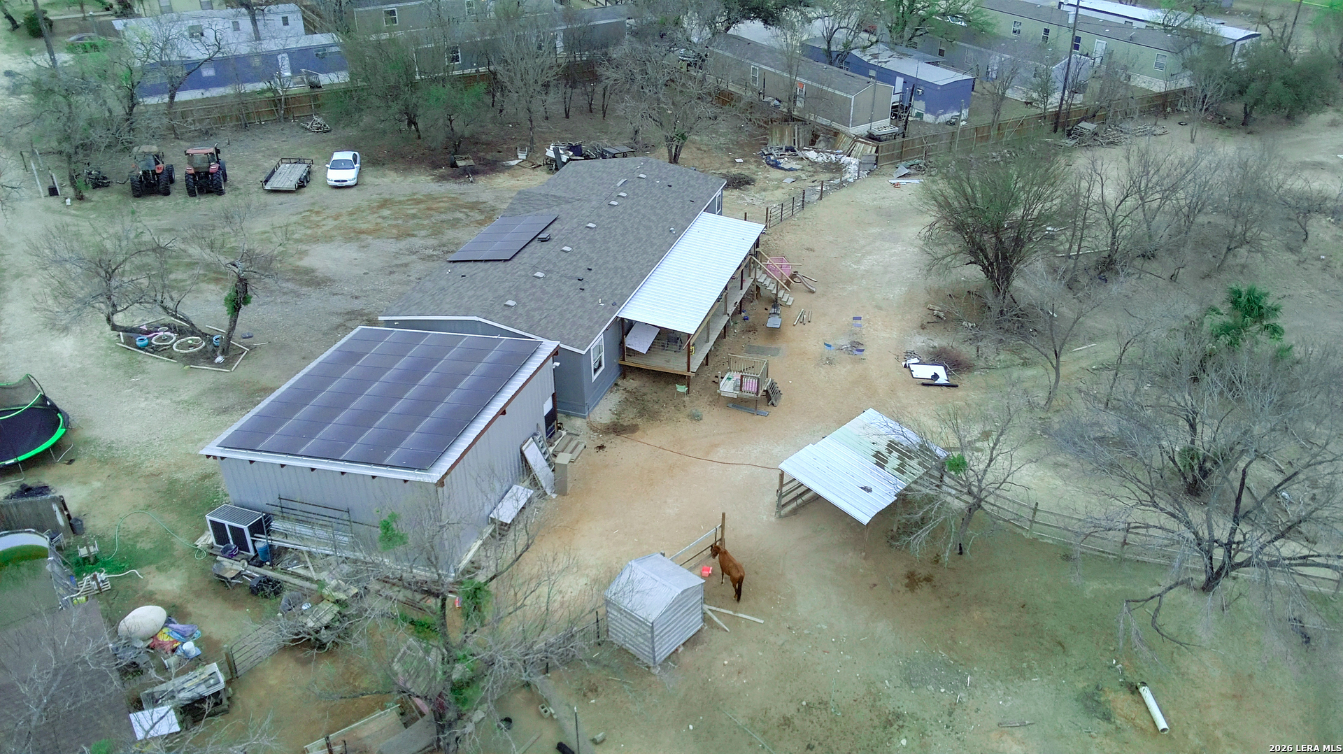 114 4th Street Natalia, TX 78059 - Photo 1 of 32 an aerial view of a house with outdoor space