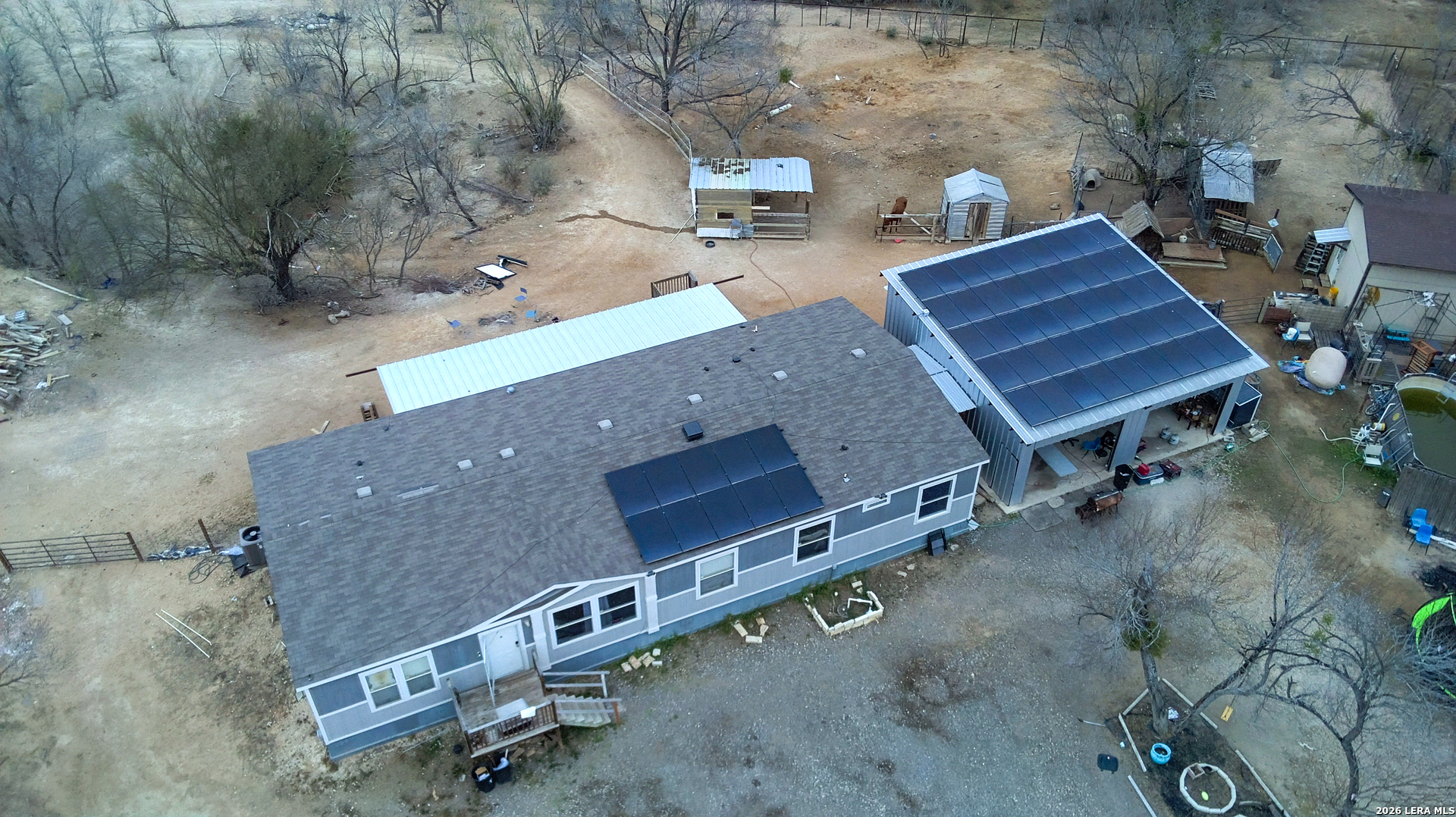 114 4th Street Natalia, TX 78059 - Photo 2 of 32 an aerial view of a house with a yard