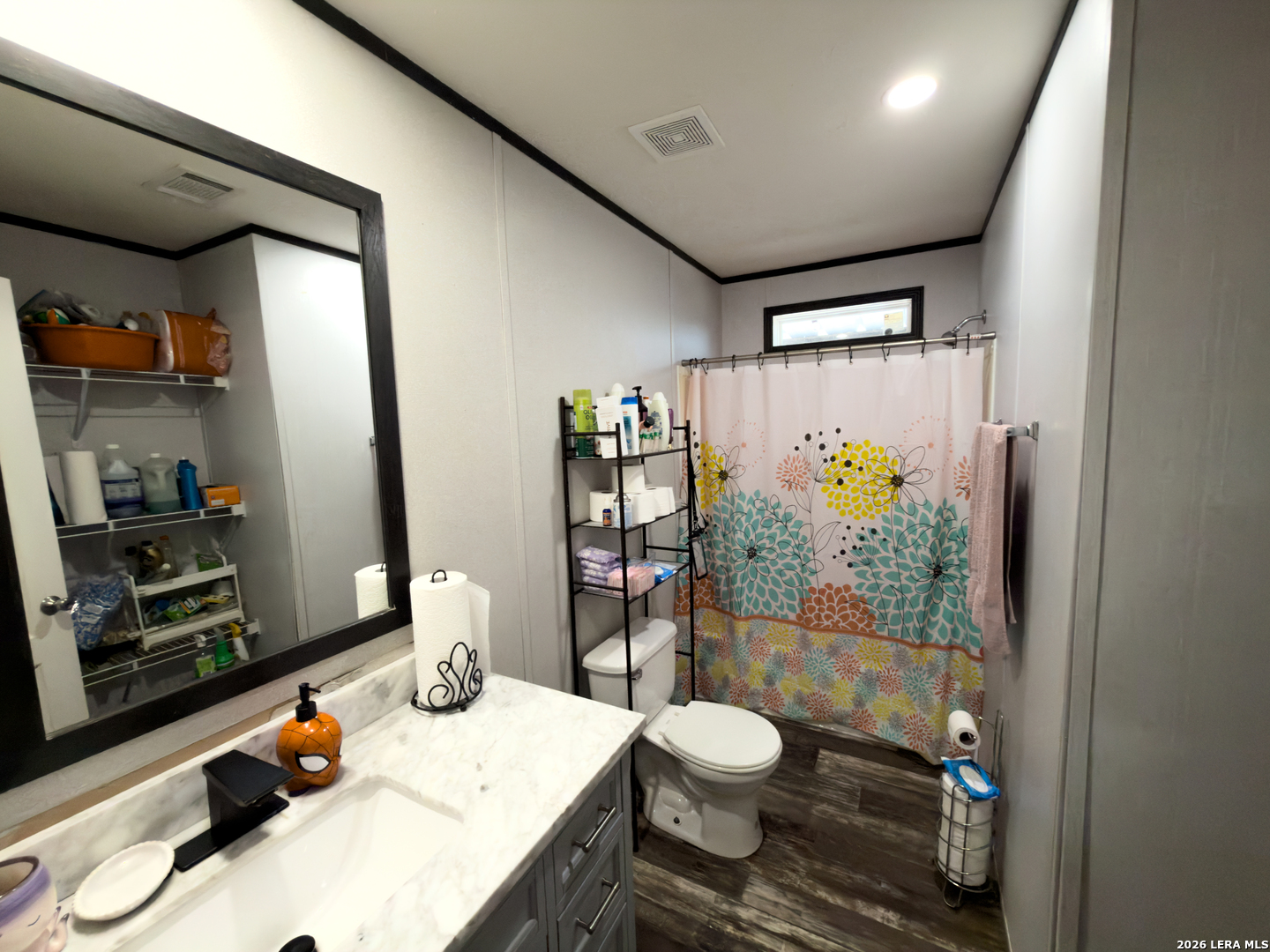 114 4th Street Natalia, TX 78059 - Photo 24 of 32 a bathroom with a sink toilet and shower