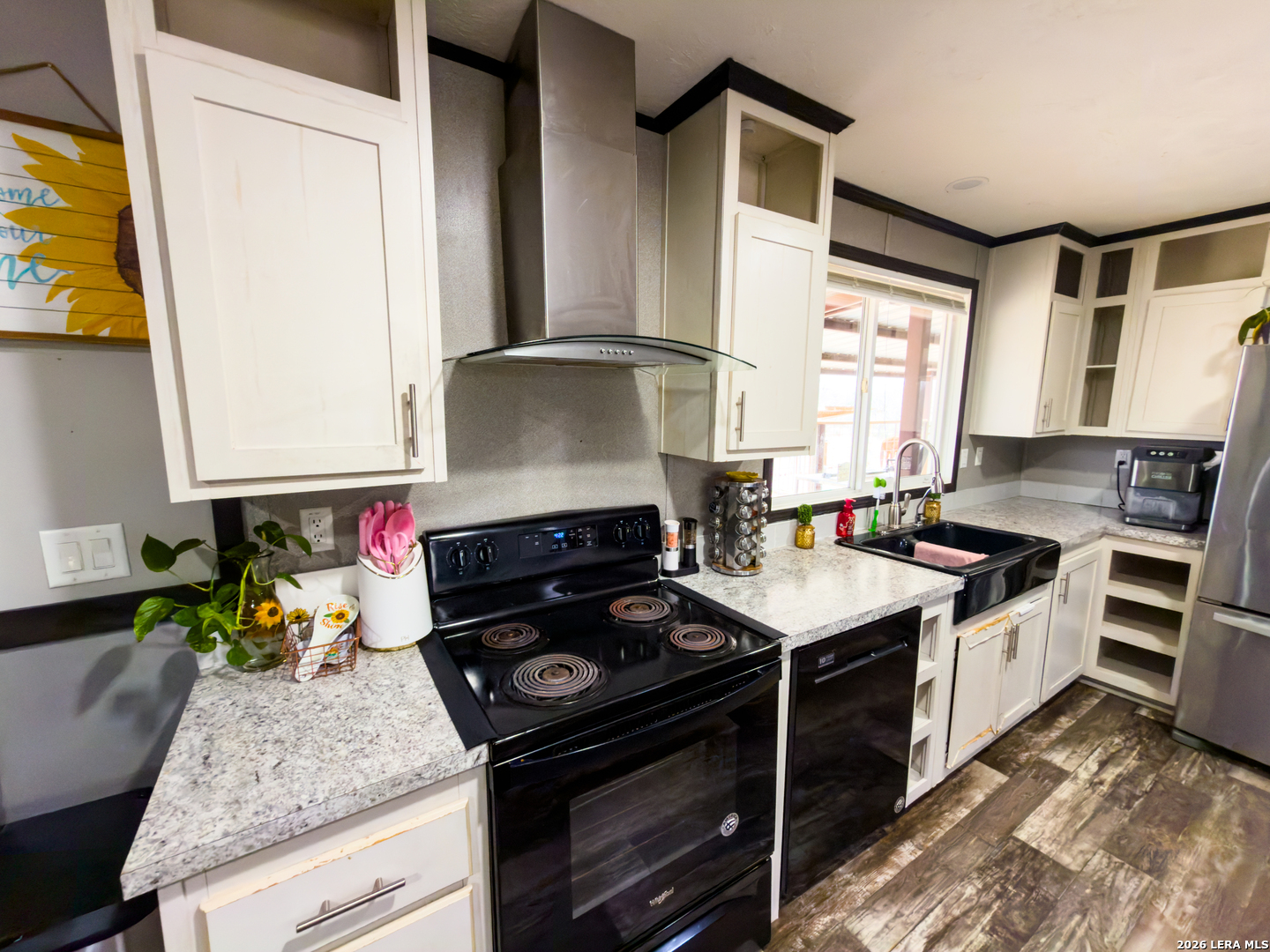 114 4th Street Natalia, TX 78059 - Photo 7 of 32 a kitchen with a stove and a sink