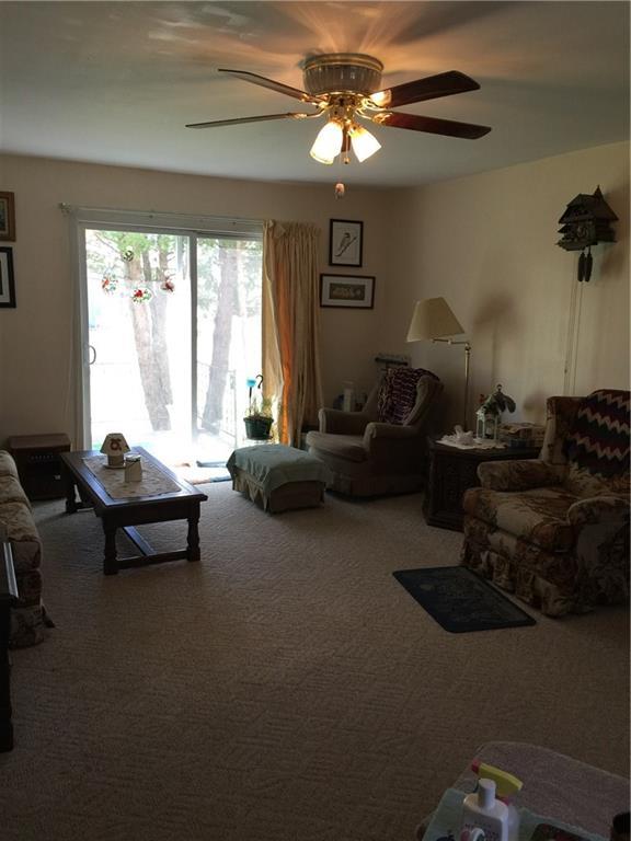 24 Wilton Road Farmington, ME 04938 - Photo 14 of 33 Living room with sliding doors that...