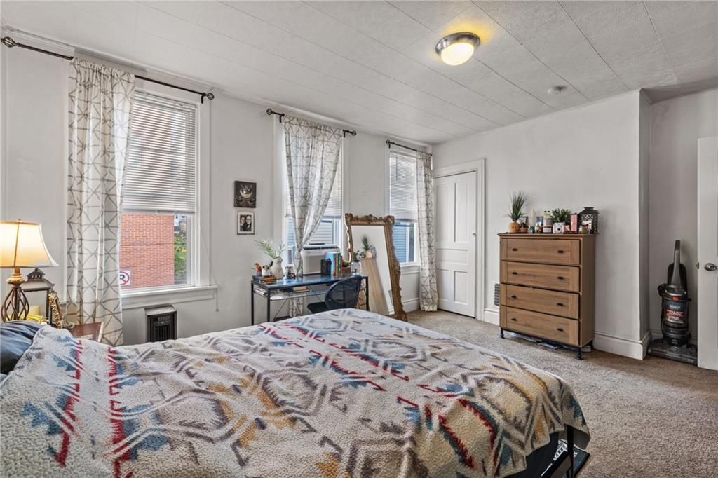 5211 Kent Way Pittsburgh, PA 15201 - Photo 11 of 18 a bedroom with a bed and a dresser