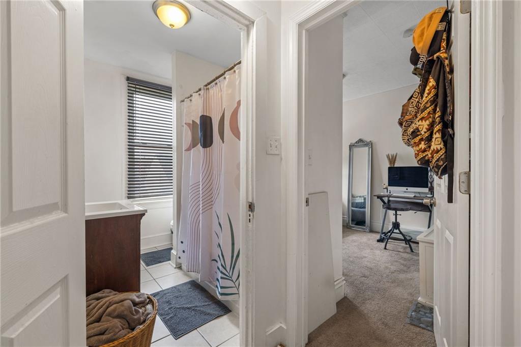 5211 Kent Way Pittsburgh, PA 15201 - Photo 15 of 18 a view of a livingroom with a chair and the entryway