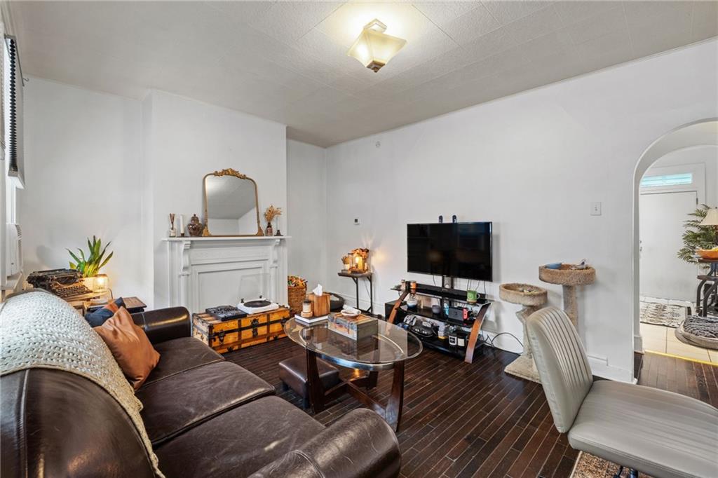 5211 Kent Way Pittsburgh, PA 15201 - Photo 3 of 18 a living room with furniture a flat screen tv and a fireplace