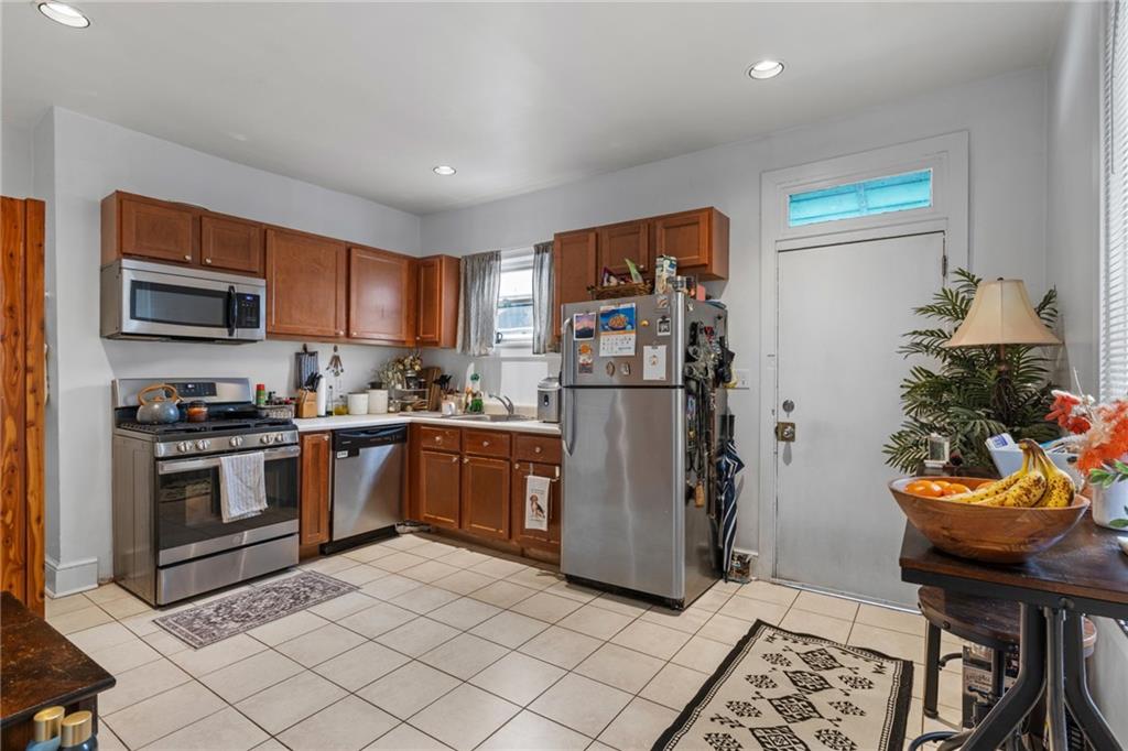 5211 Kent Way Pittsburgh, PA 15201 - Photo 6 of 18 a kitchen with stainless steel appliances granite countertop a refrigerator sink and stove