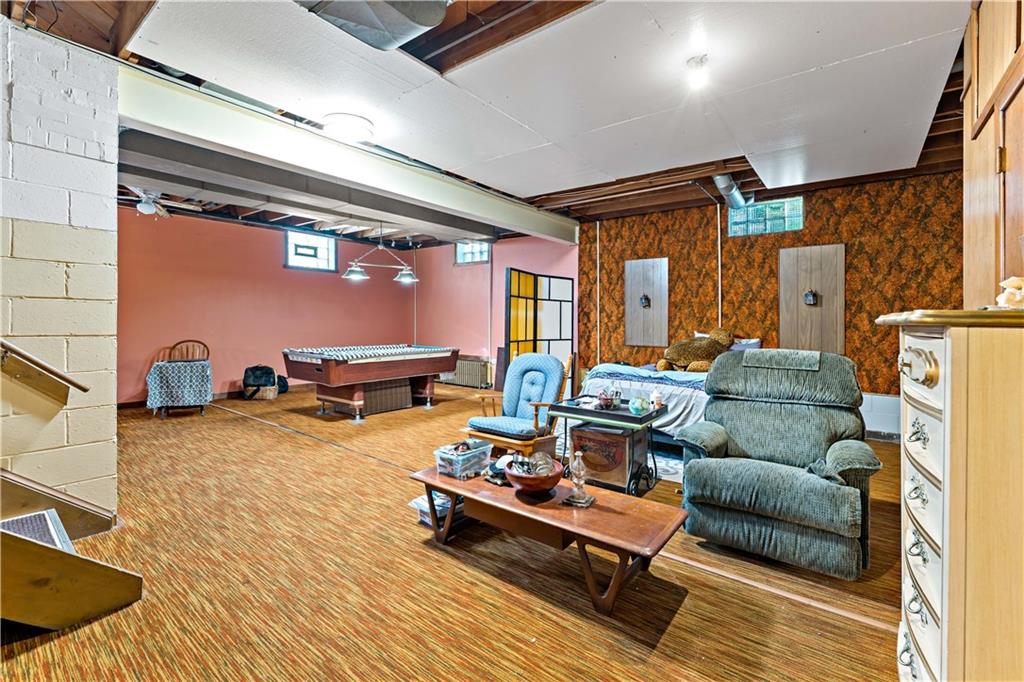 38 May Avenue McKees Rocks, PA 15136 - Photo 23 of 38 a living room with furniture a rug and a wooden floor