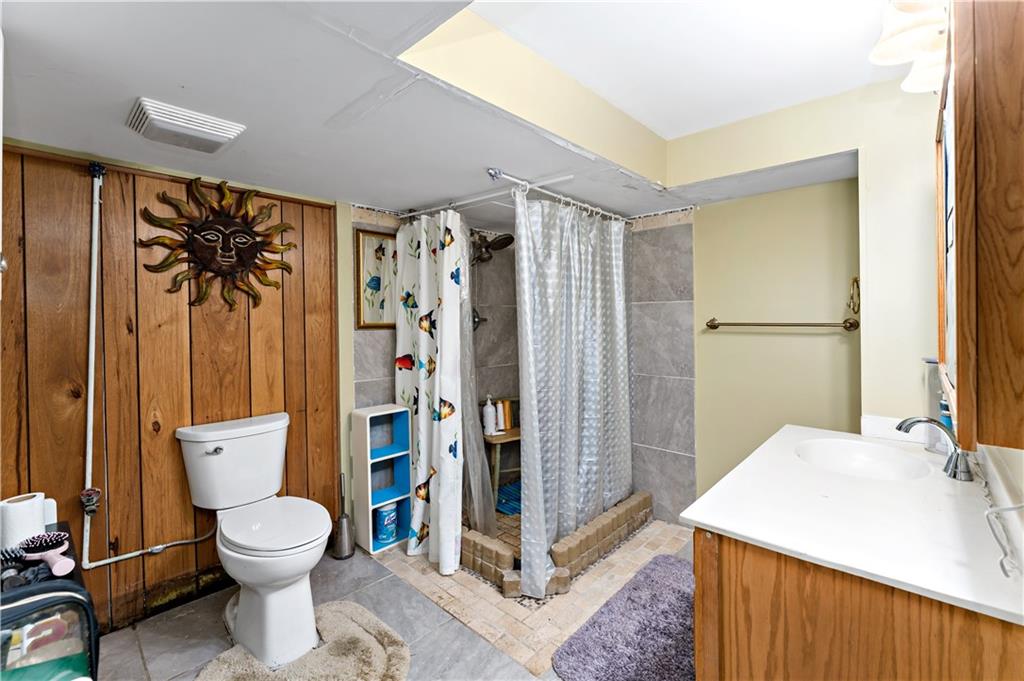 38 May Avenue McKees Rocks, PA 15136 - Photo 29 of 38 a bathroom with a toilet a sink and a shower
