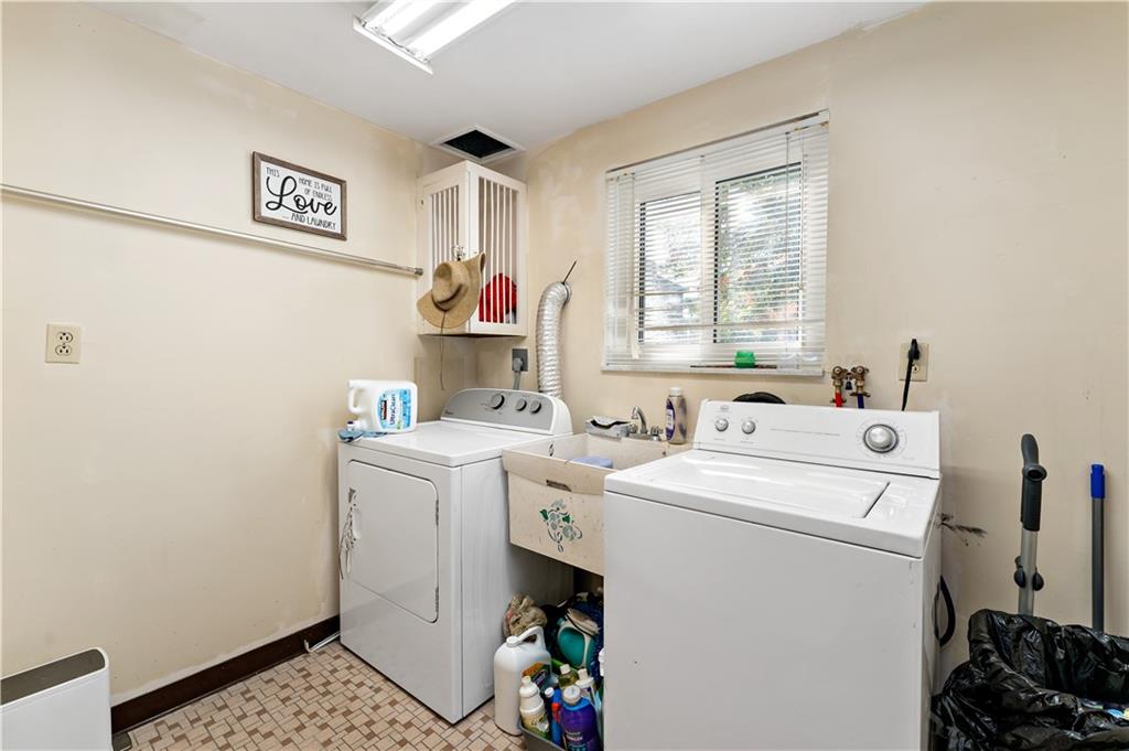 38 May Avenue McKees Rocks, PA 15136 - Photo 31 of 38 a utility room with dryer and washer