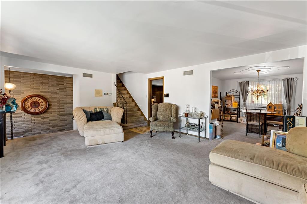 38 May Avenue McKees Rocks, PA 15136 - Photo 4 of 38 a living room with furniture and a clock