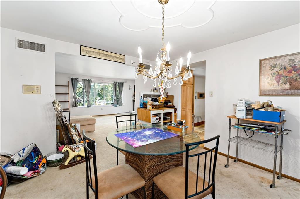 38 May Avenue McKees Rocks, PA 15136 - Photo 6 of 38 a view of a dining room with furniture and a chandelier