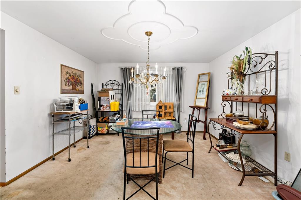 38 May Avenue McKees Rocks, PA 15136 - Photo 7 of 38 a view of a dining room with furniture window and wooden floor